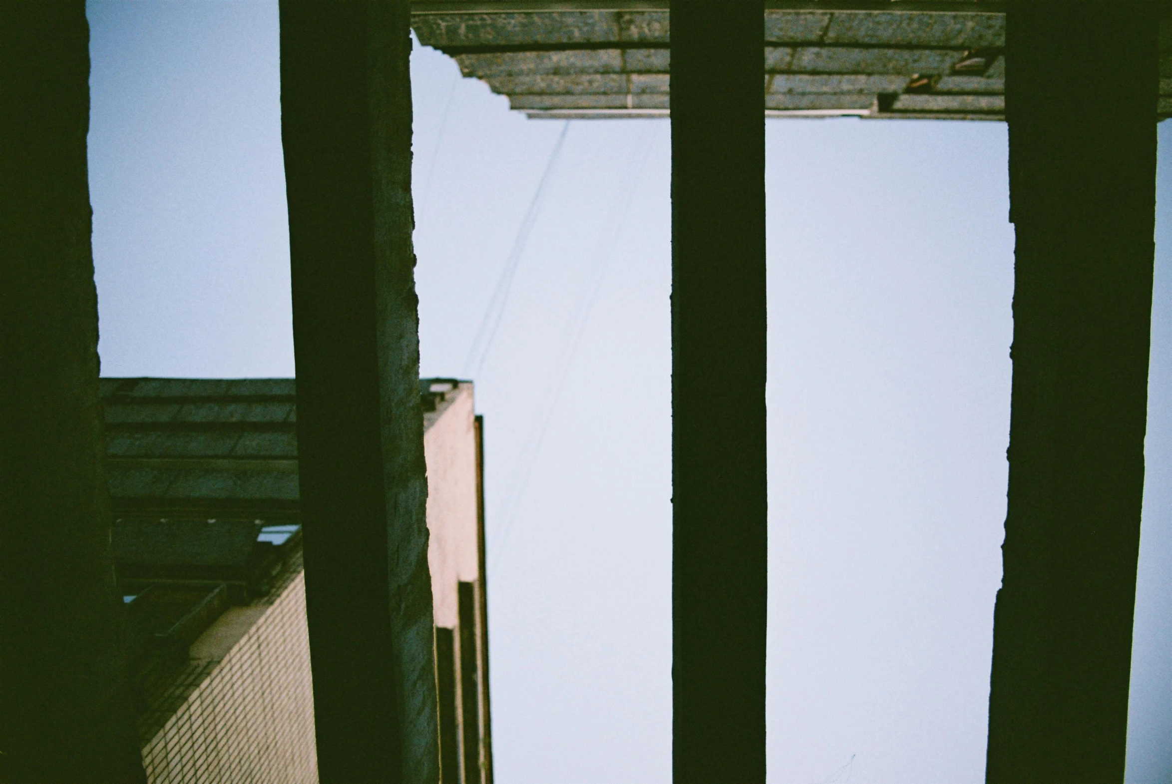 a view through a window into a fence