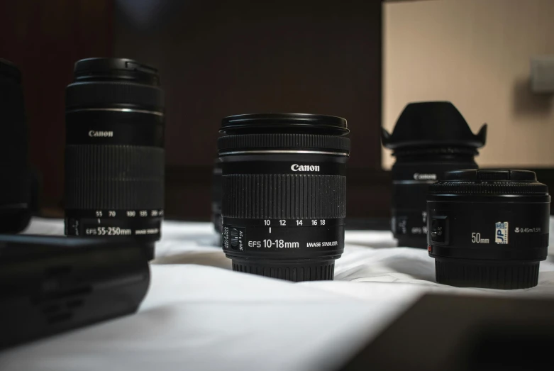 a table with four different cameras sitting next to each other