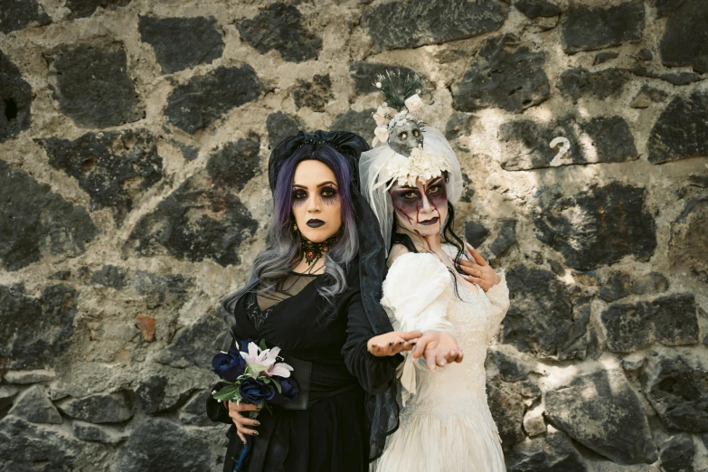 two people dressed up in costume standing next to each other