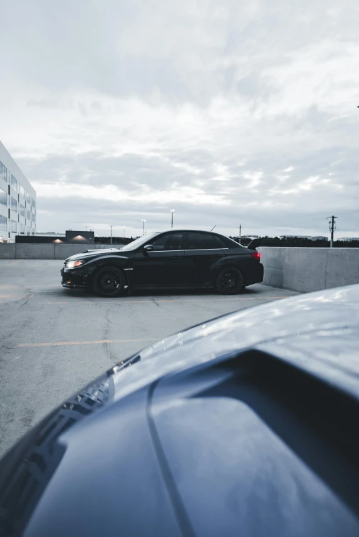 a car parked near a cement wall