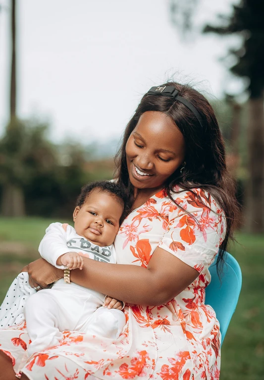 an image of an adult holding a baby