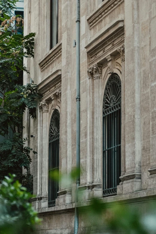 an old style building with wrought iron windows and shutters