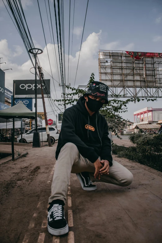 a man sitting on top of a block of land