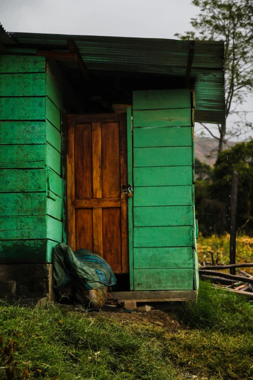 two wooden doors and a door sitting next to each other