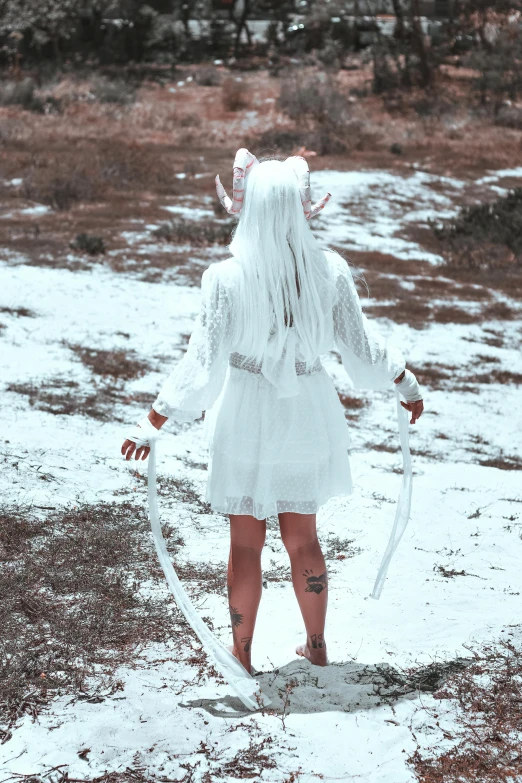 a female character with long hair and large white horns