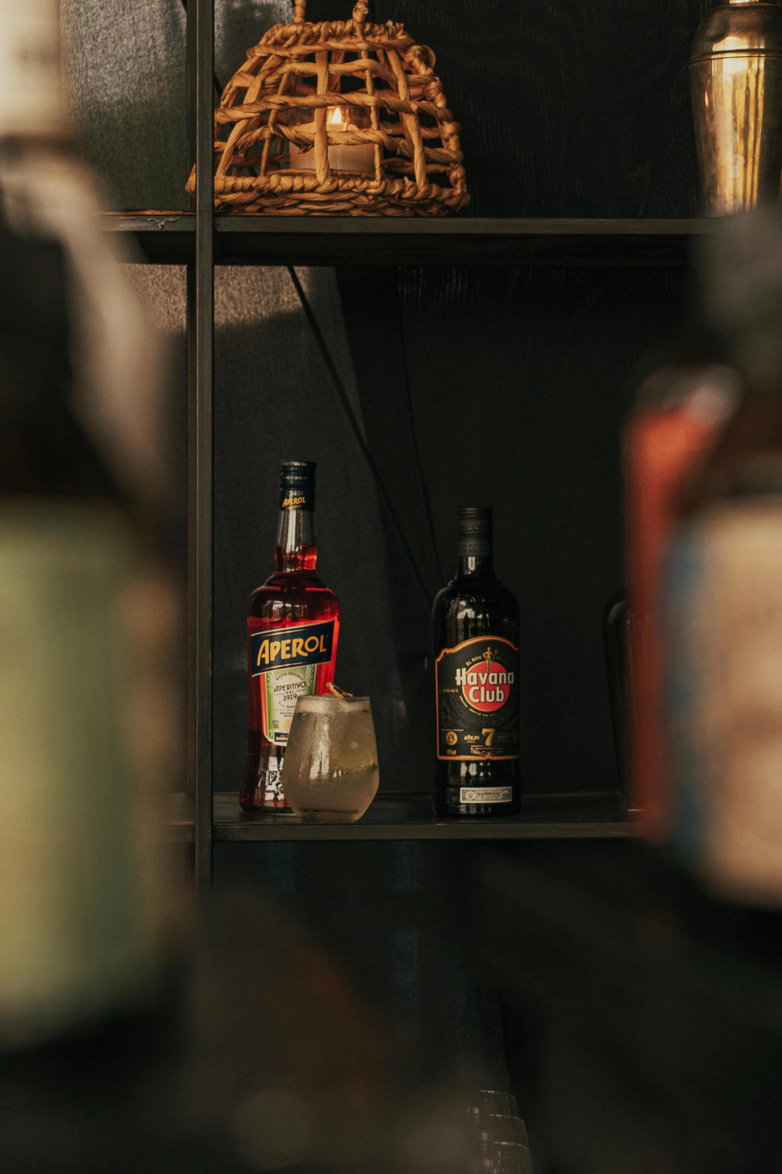 some bottles are placed on some shelves