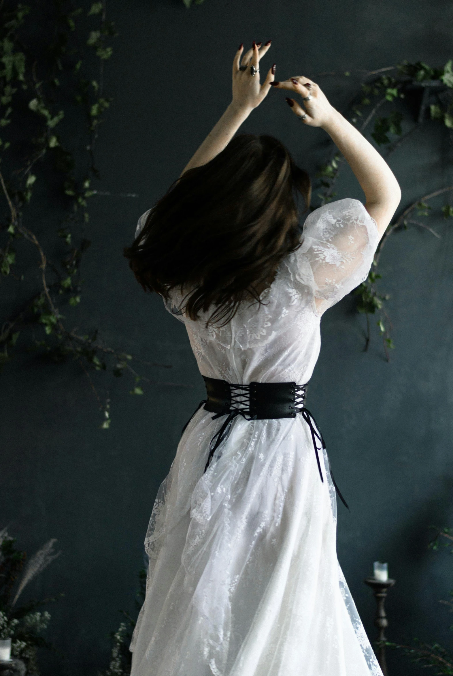 a woman in a white dress standing up