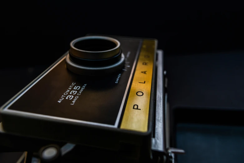 the lens mounted on top of an old film camera