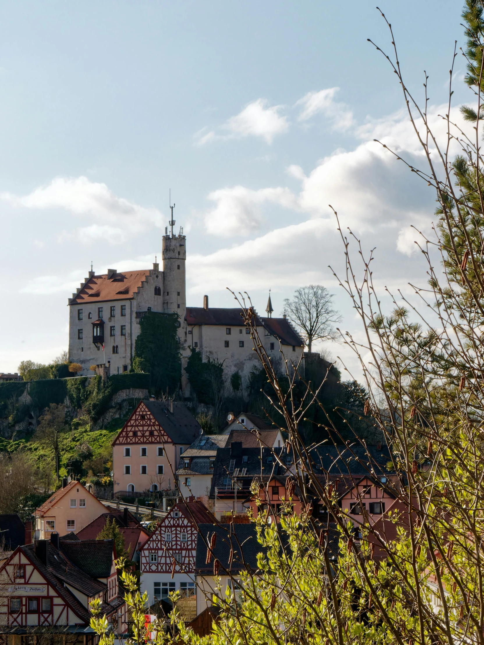 a big castle that is standing on a hill