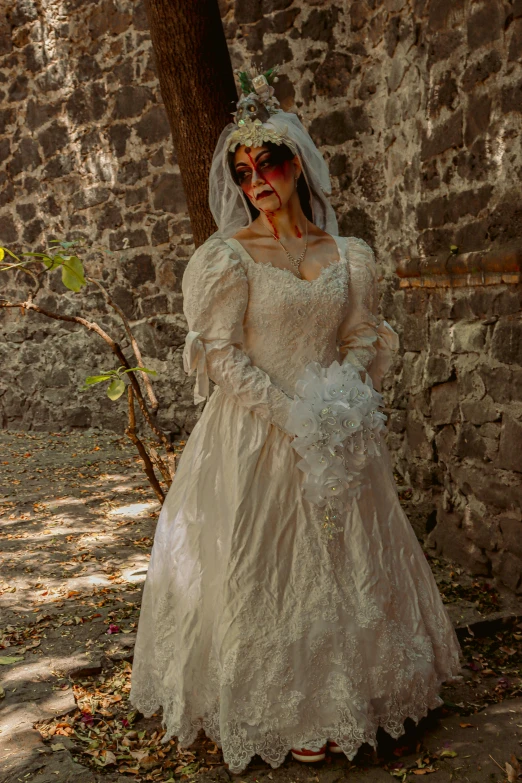 an old woman dressed in a wedding gown, is posing for the camera