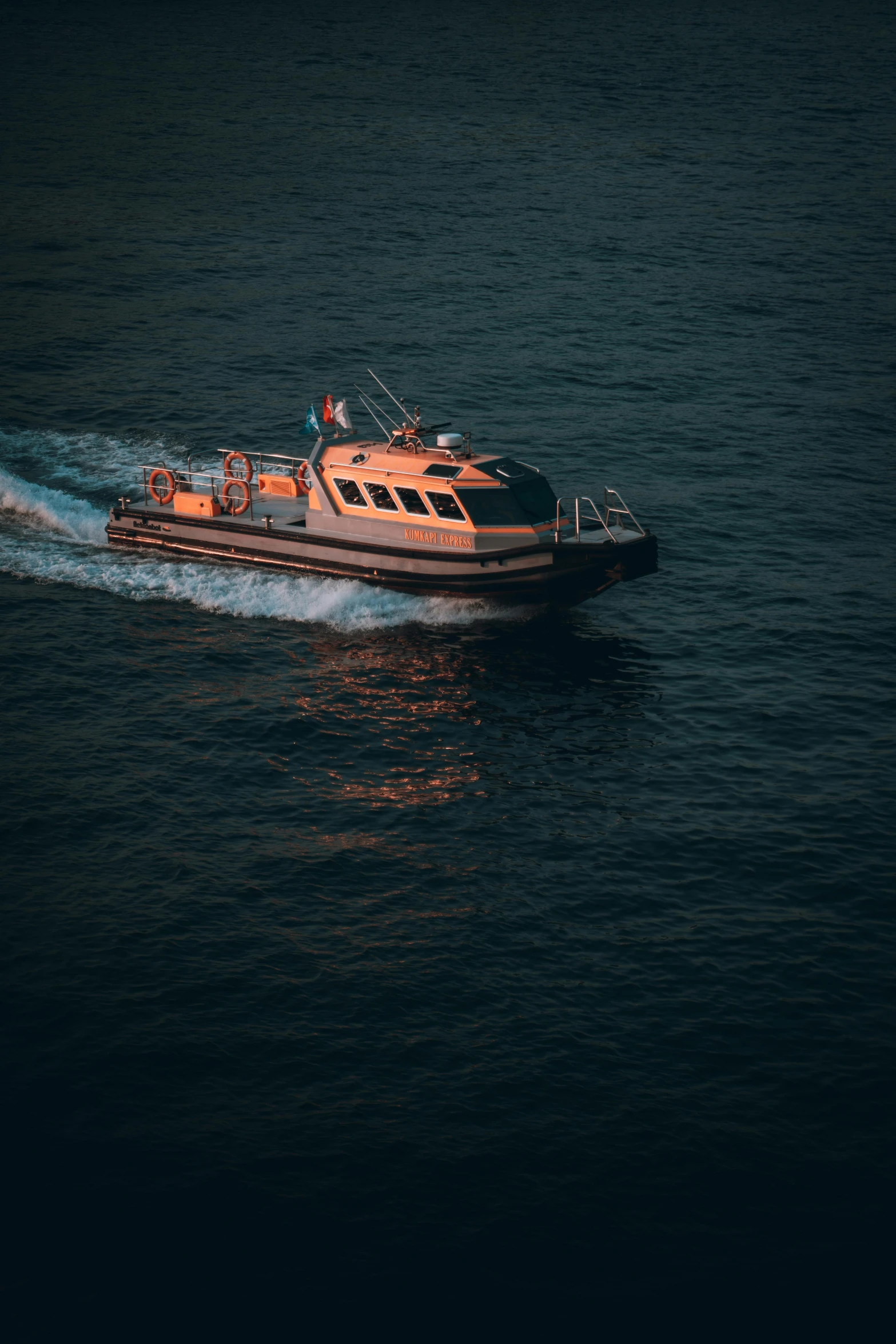 a wooden boat on water in the dark