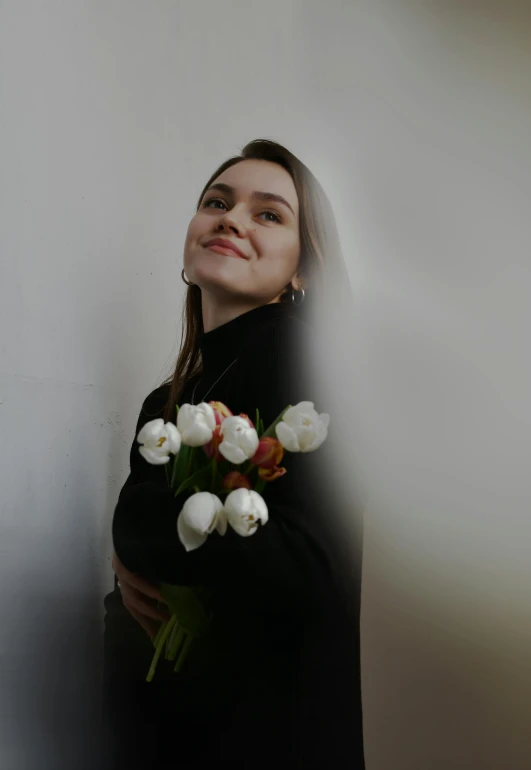 a woman with a bouquet of white flowers