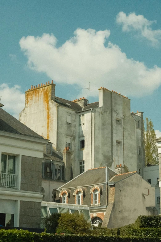 buildings and windows on the side of a hill