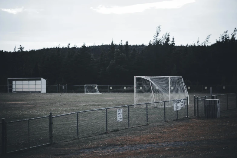 a football goal on the field during the night