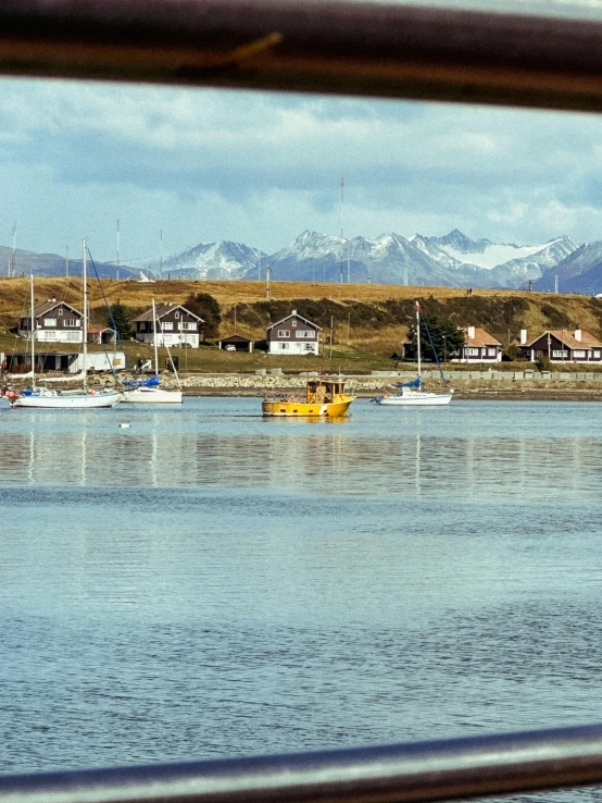 a river filled with lots of boats and buildings