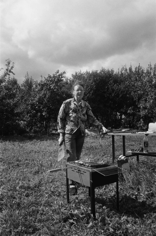 a lady that is standing in the grass