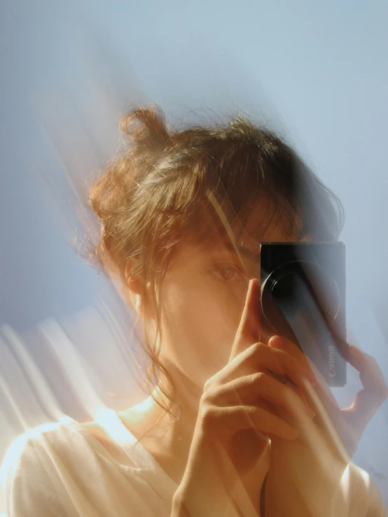 this is a selfie taken in a bathroom mirror