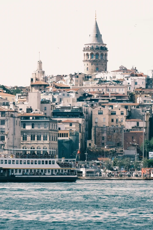 a view of the city and water next to a bridge