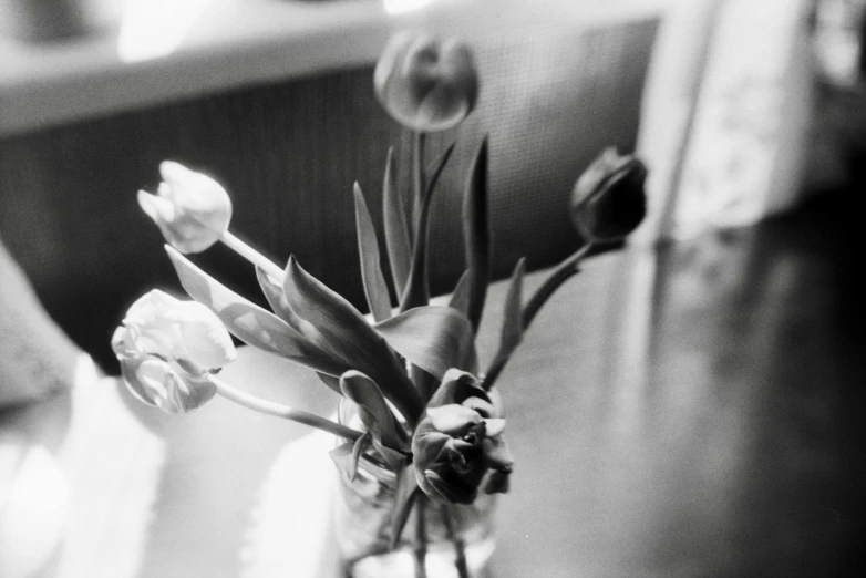 a vase with some flowers inside it on the table