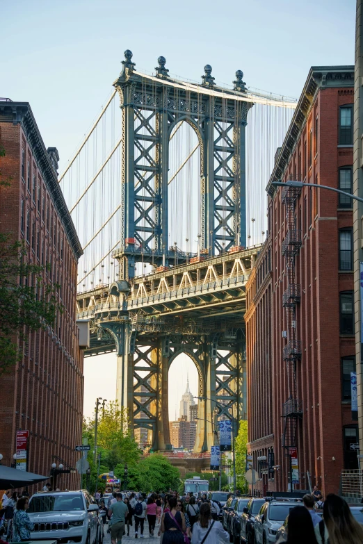 pedestrians walking in a sidewalk between buildings