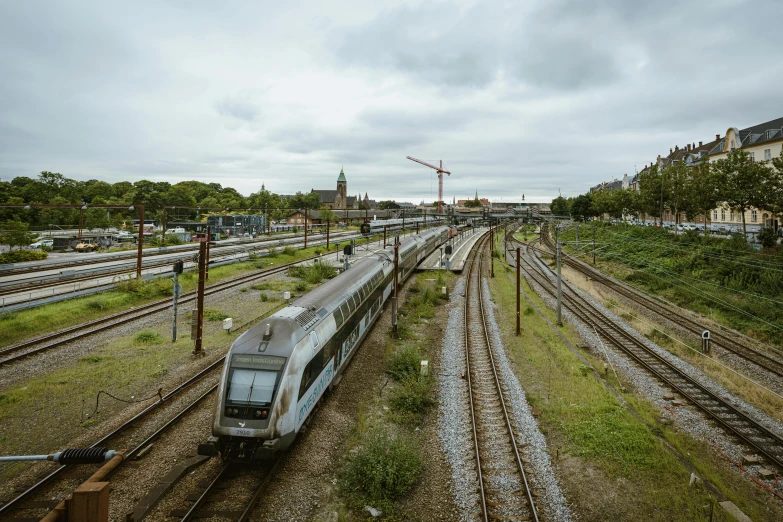 a long train riding down some train tracks