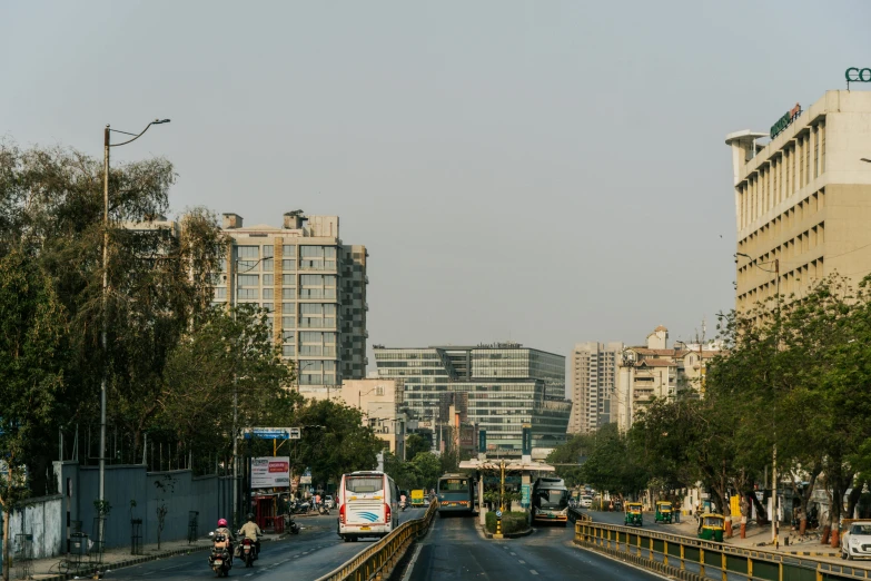 a busy road with lots of trees in the middle of it