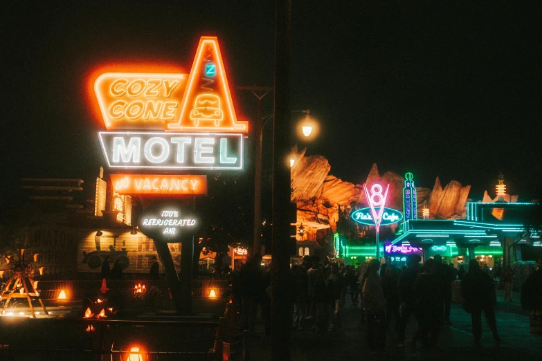 an image of a motel at night time