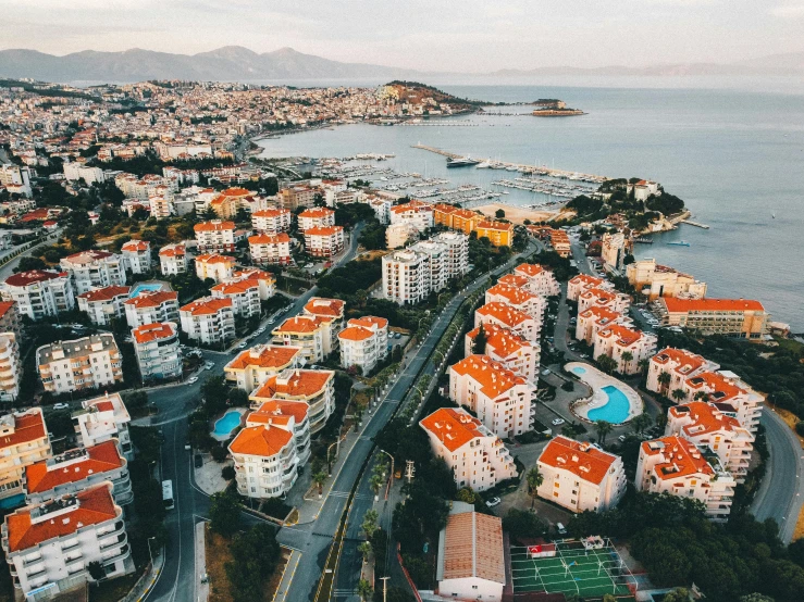 a very colorful city by the water with lots of buildings and houses