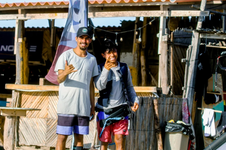 the young couple is posing for a picture outside