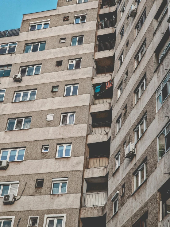 an old looking apartment building with balconies