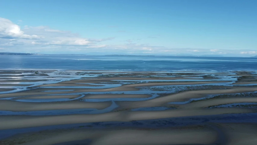 a river bed covered in lots of dirt by the ocean