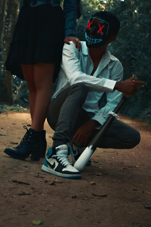 two people with their shoes on in the dirt