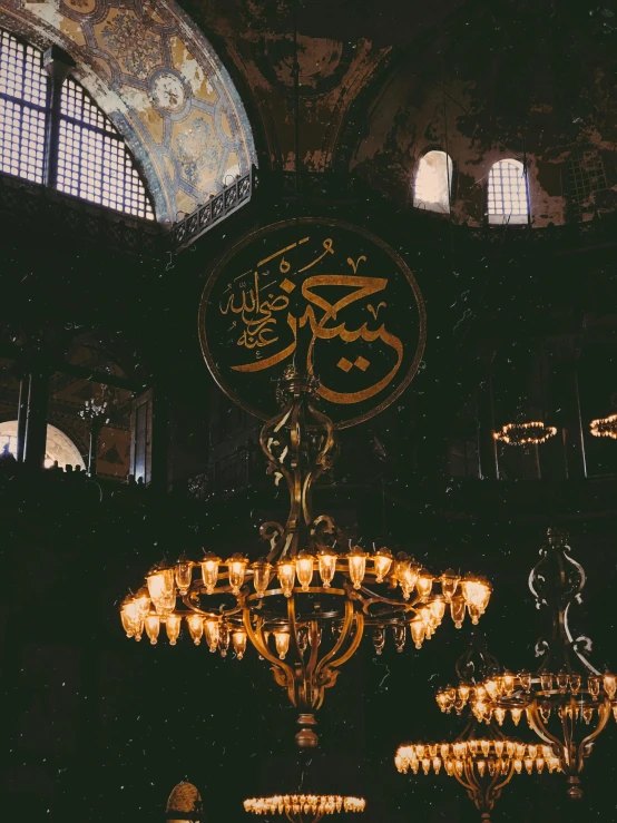 chandelier in ornately decorated building with large mirror windows