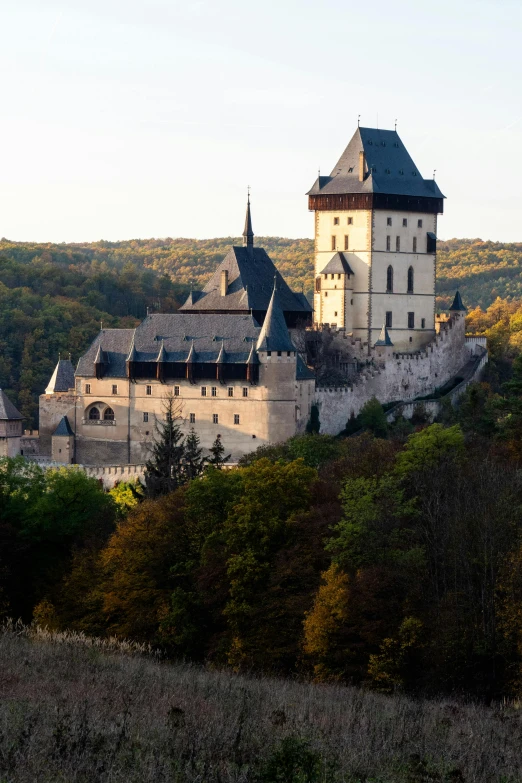 a tall castle that has two towers on top of it