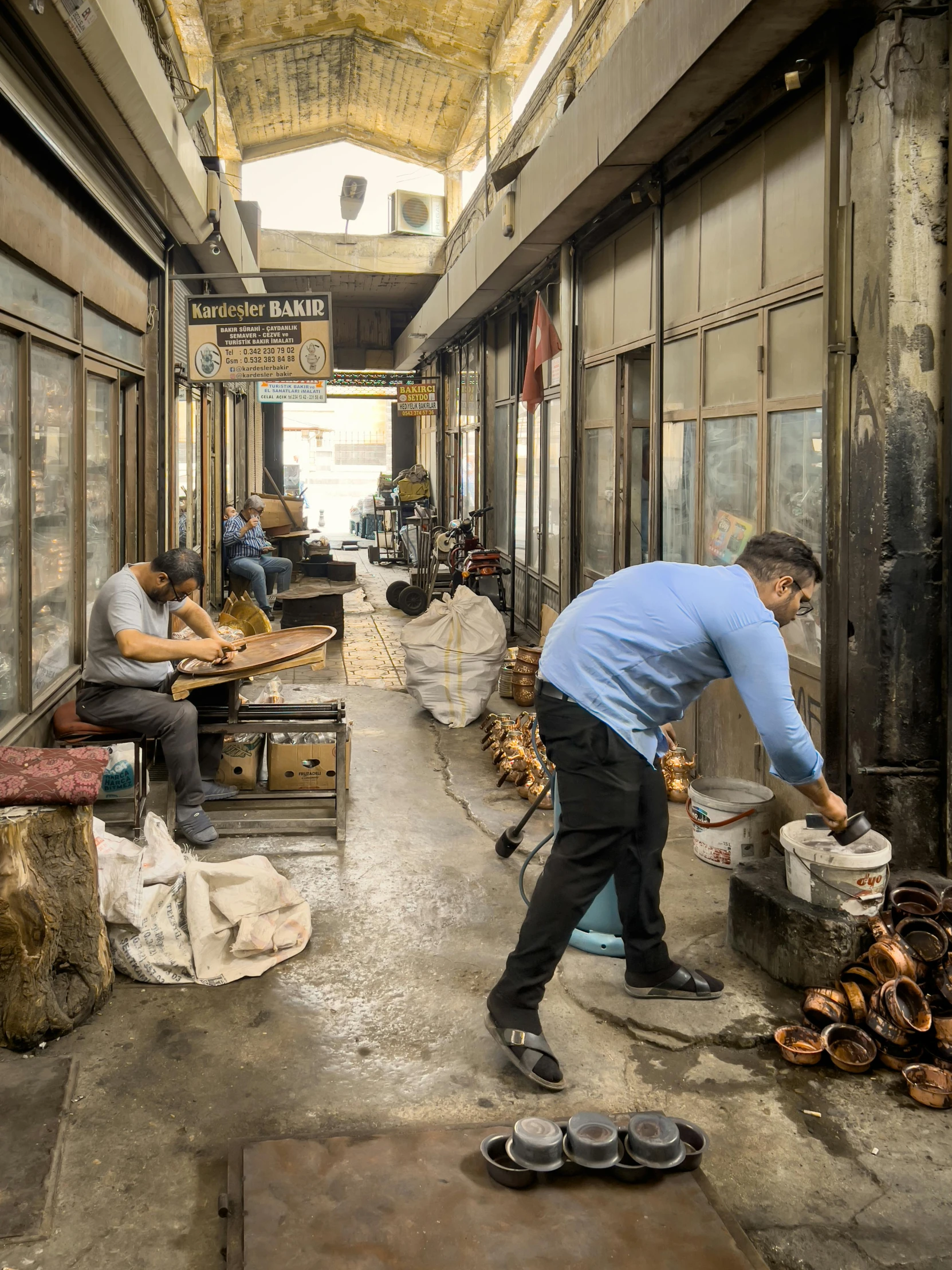 an older man is in a shoe repair shop