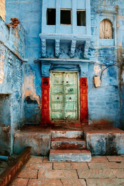 an entrance to a house with some steps