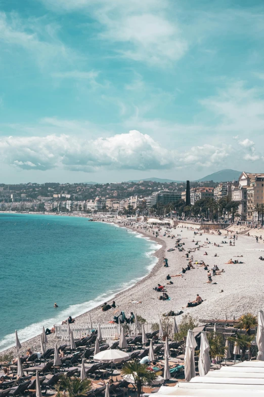 people on the beach and in the water at the beach