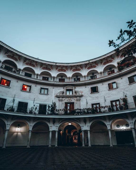 the top of a building with an arched walkway