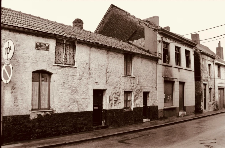 black and white image of an old street in an older fashioned town