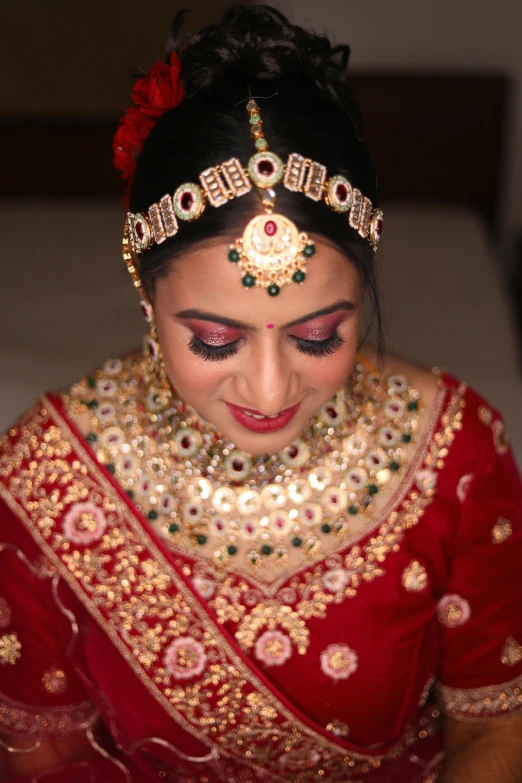 a beautiful woman wearing a necklace on her head