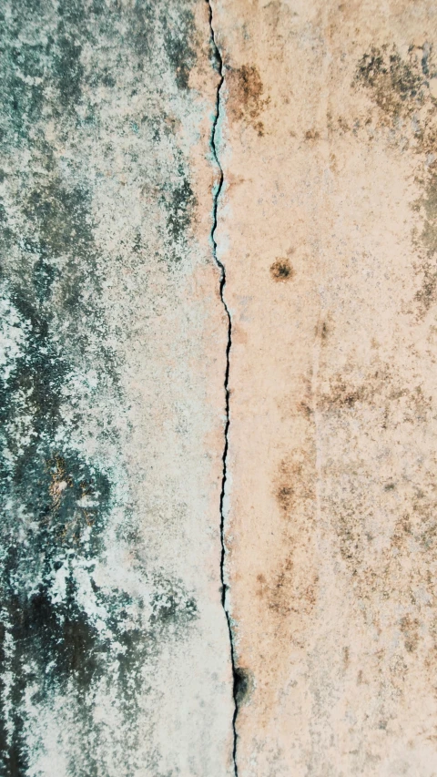 a  in a concrete wall that's showing where water could be seen