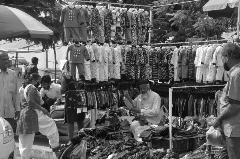 people are sitting in front of a display with clothing