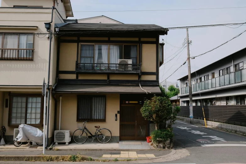 a row of house on a street with bikes parked outside