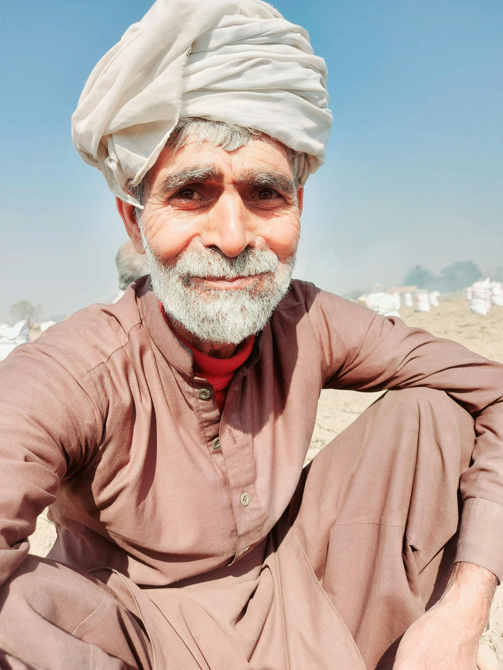 an old man with white beard and turban