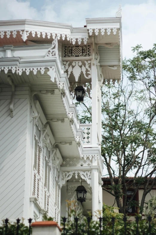 a large white house with lots of woodenwork