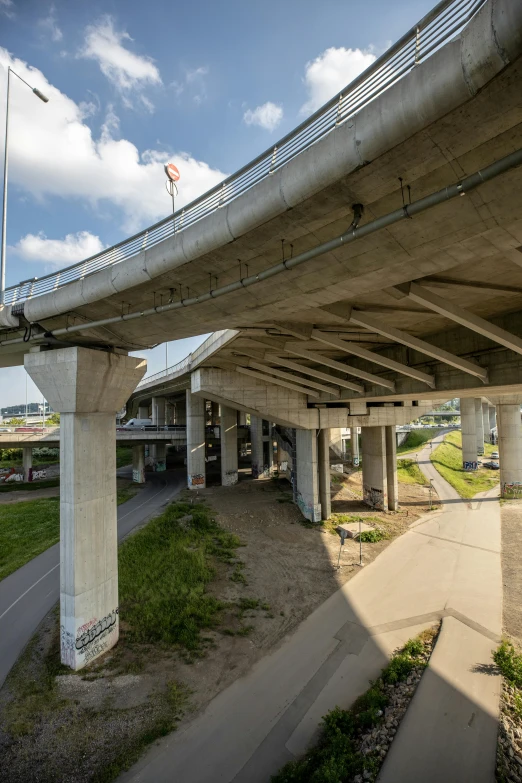 a view of an overpass with two white pillars