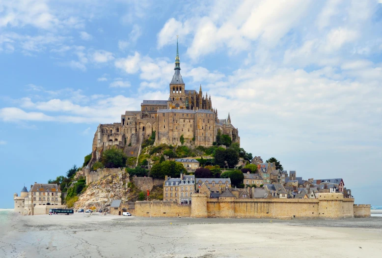 a large castle sitting on top of a beach