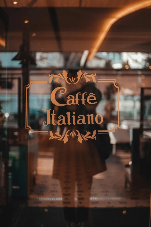 a restaurant front with a woman looking out of the window