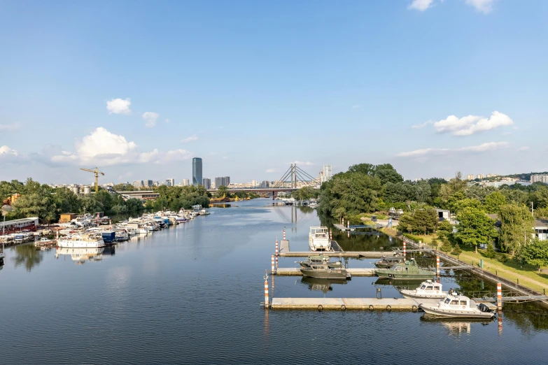 the water is lined with small boats on both sides