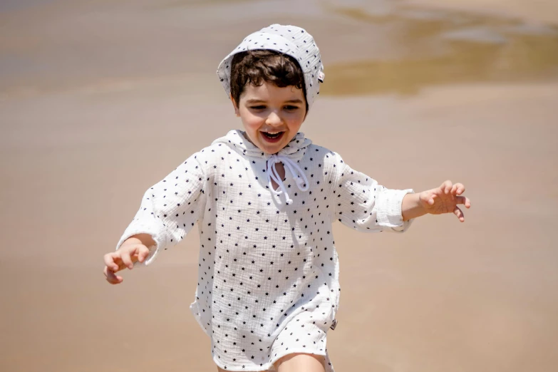 a  running through shallow water on a beach